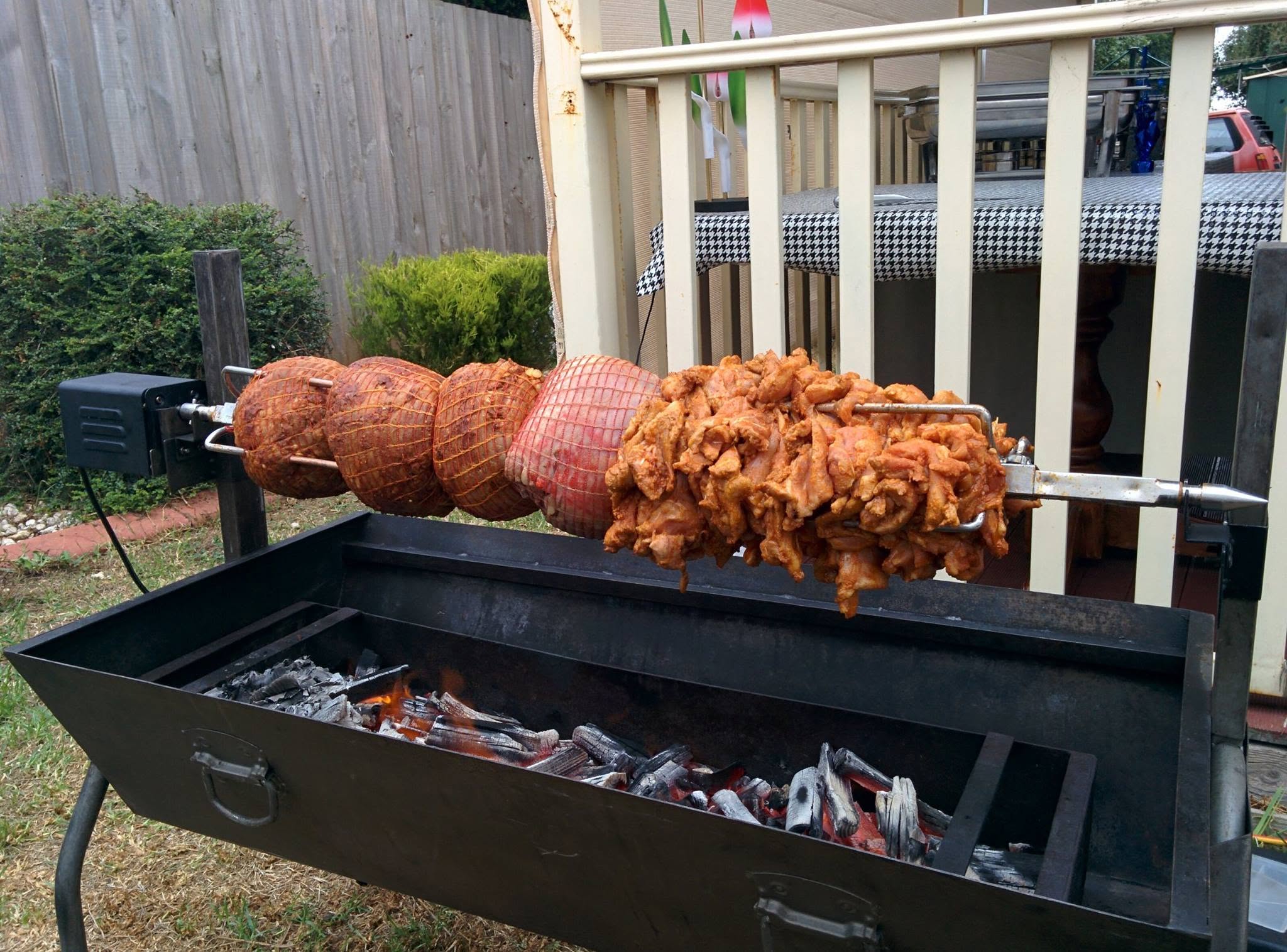 Pork, lamb and chicken prepared on a charcoal spit roaster